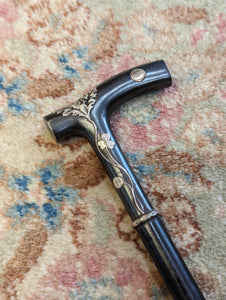 Black Walking Cane with Metal Handle and Foliated Applique