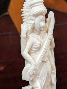 Ivory Carving of a Deity with a Sitar & Crane