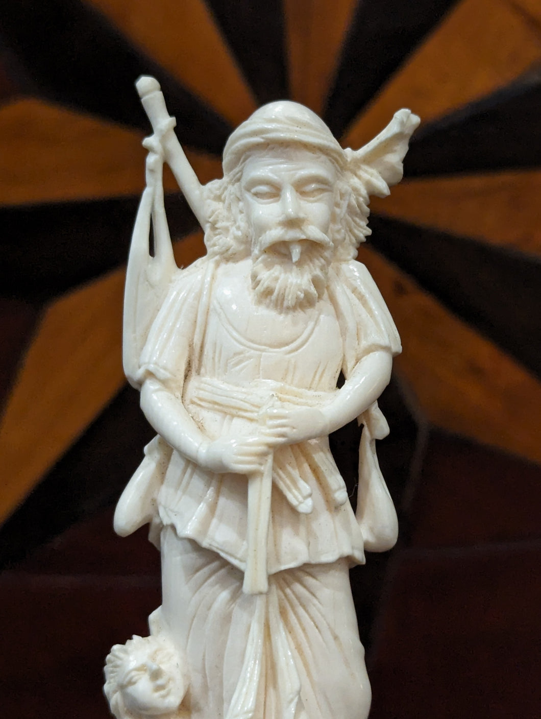 Ivory Carving of a Travelling Man, Child & Snake