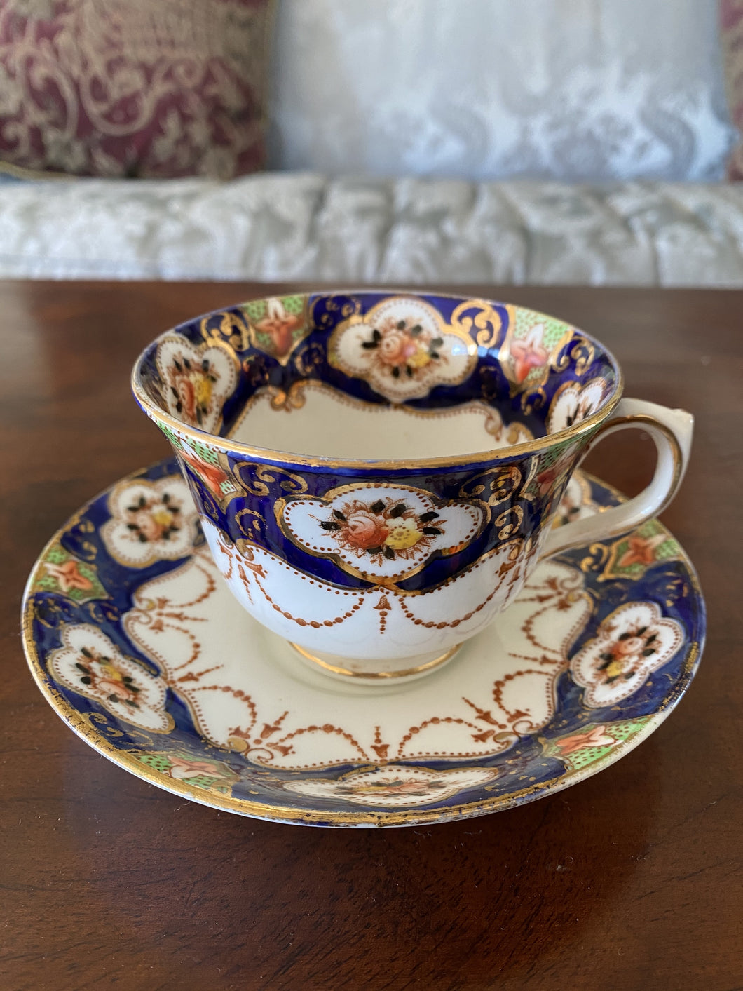 JP0006 1920 - 1935 Vintage Royal Albert Crown Bone China Teacup and Saucer with gold trim in a dark blue ornate